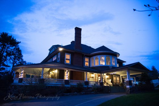 mansion lit up at twilight