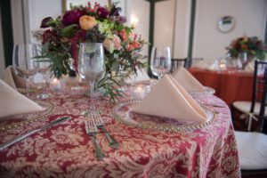 Bold paisley combined with off white napkins tie everything together in this non-traditional table setting.