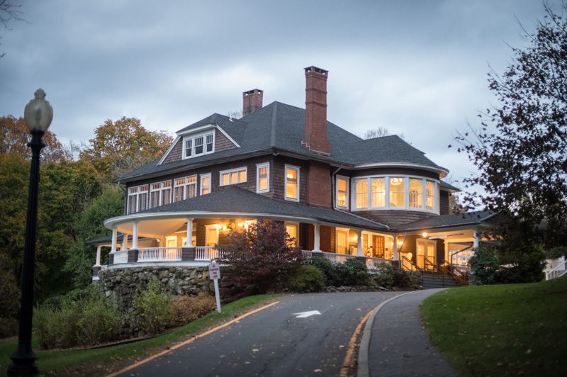 mansion lit up at dusk for fall event