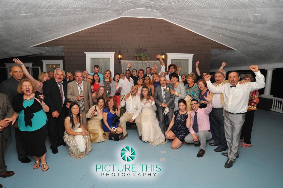 a-victorian-era-wedding-reception-group-photo-on-veranda