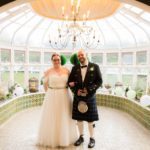 bride-groom-standing-in-conservatory