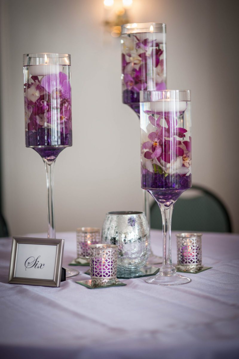 high floating candle holders with purple flowers