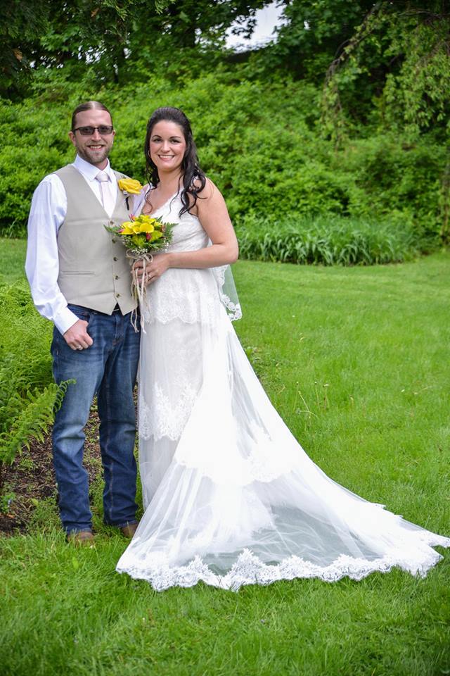 may wedding couple together on lawn