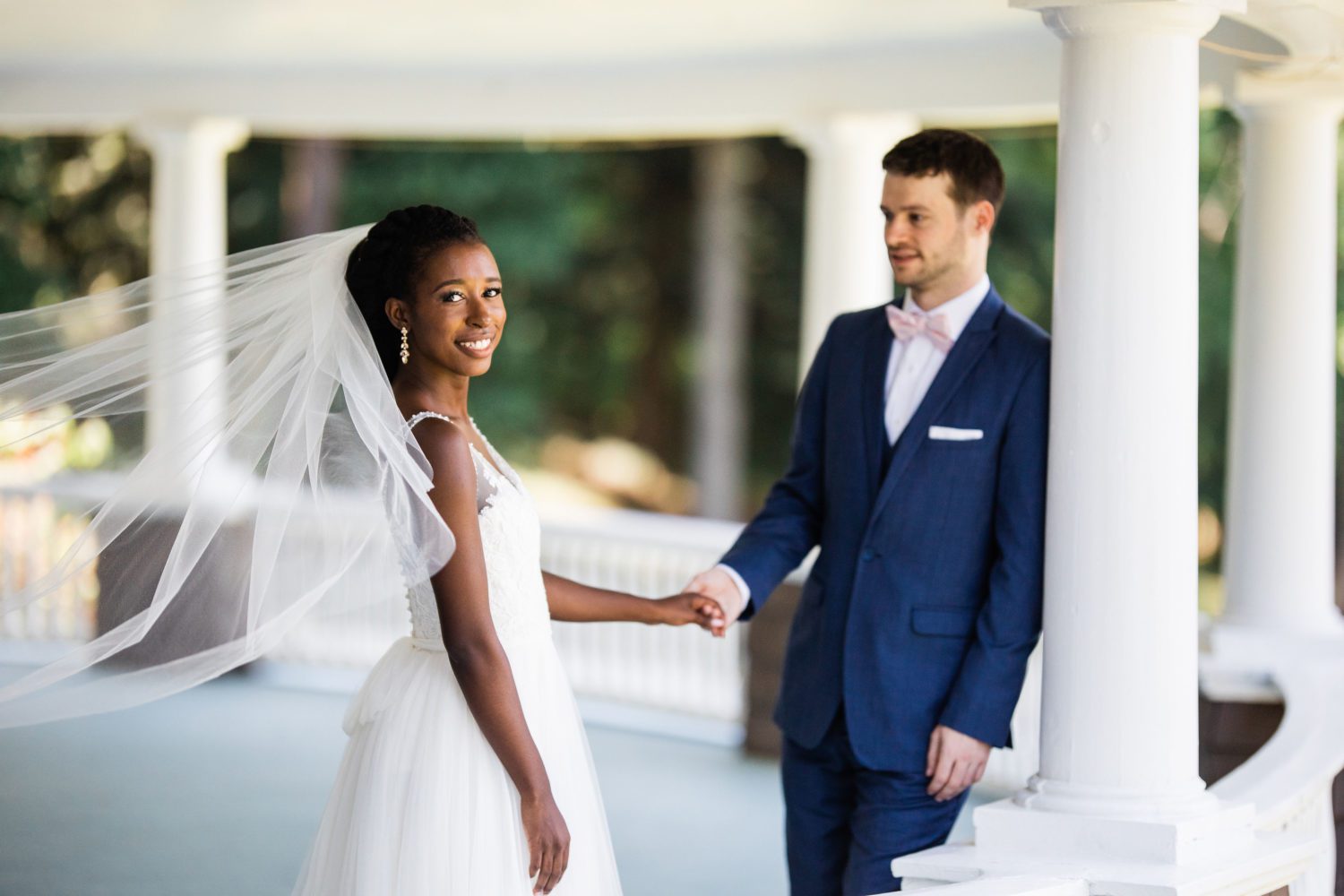 a-july-tent-wedding-couple-on-veranda