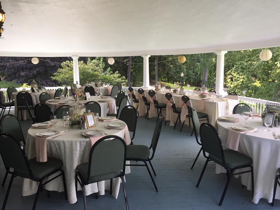 veranda set up with guest seating and the head table