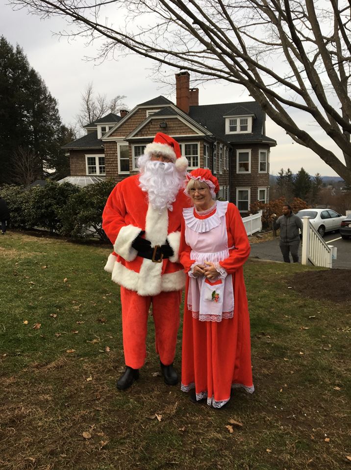 candy-cane-hunt-mr-mrs-claus-together-on-lawn