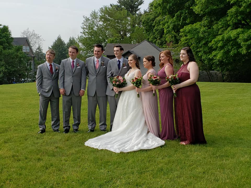 casual-wedding-party-together-on-lawn