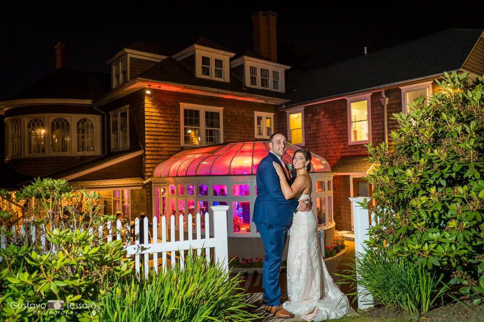 tarrywile-hikers-together-with-lighted-mansion-in-background