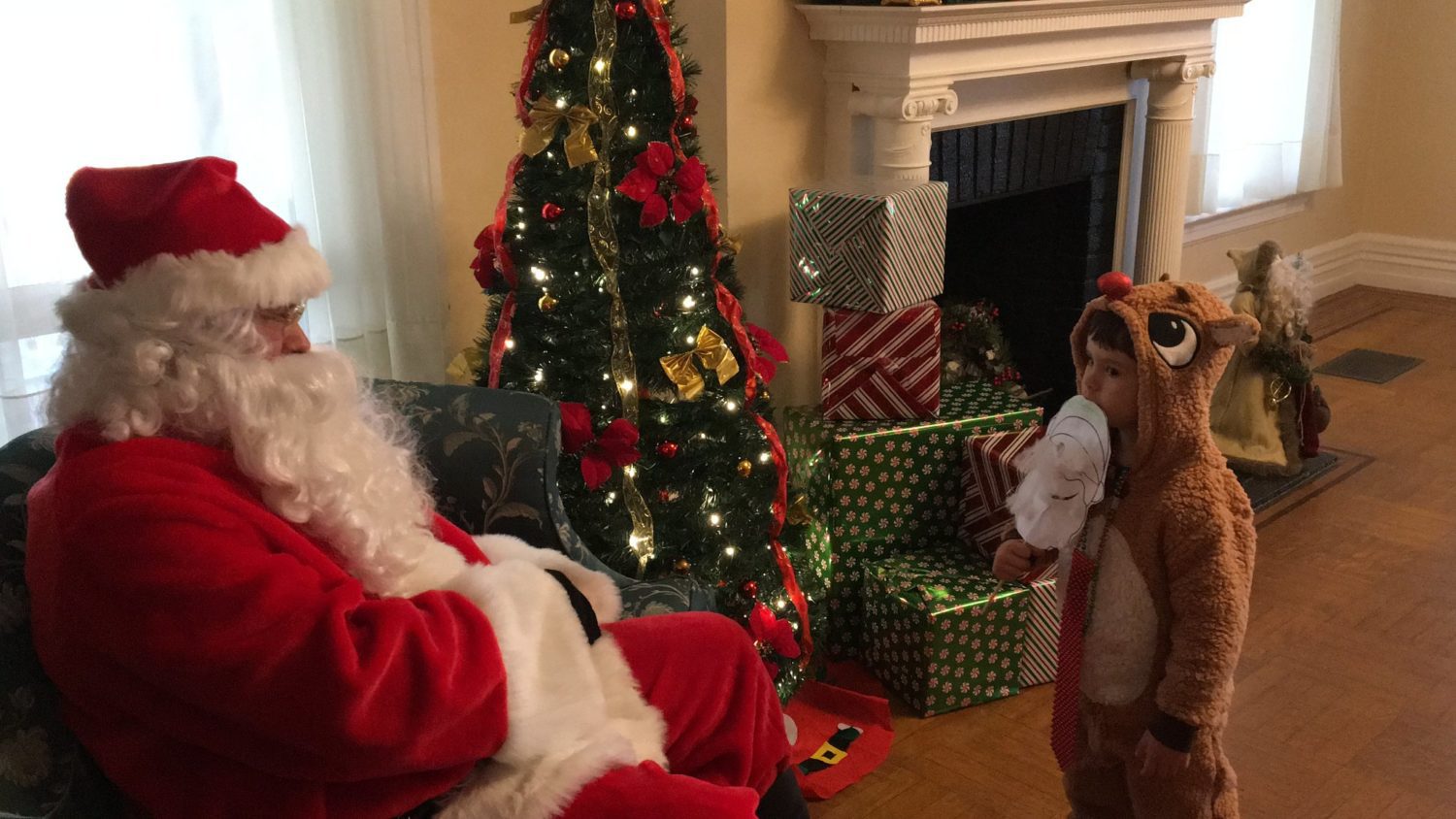 santa-with-child-in-reindeer-costume