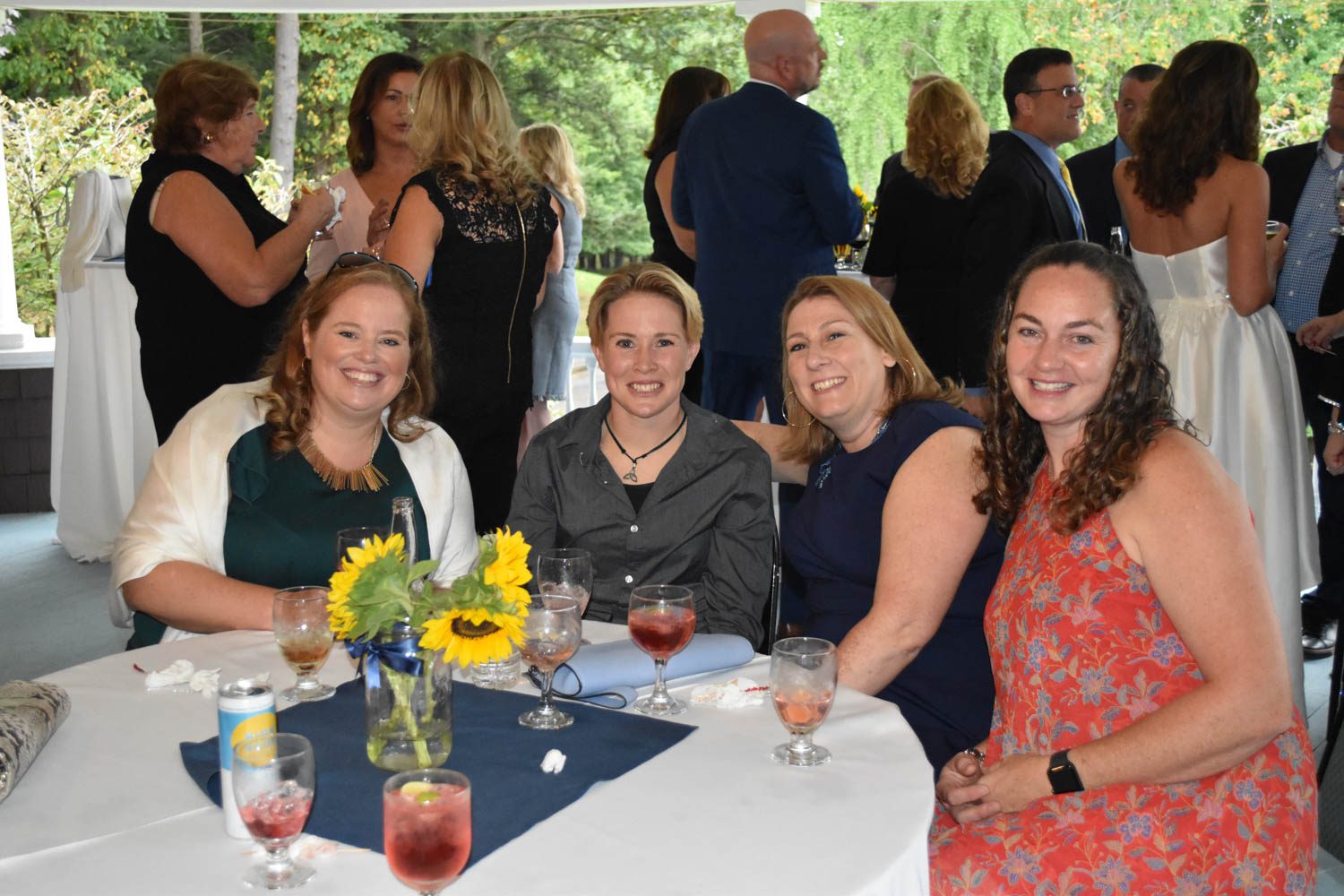 wedding-guests-seated-outside-on-veranda